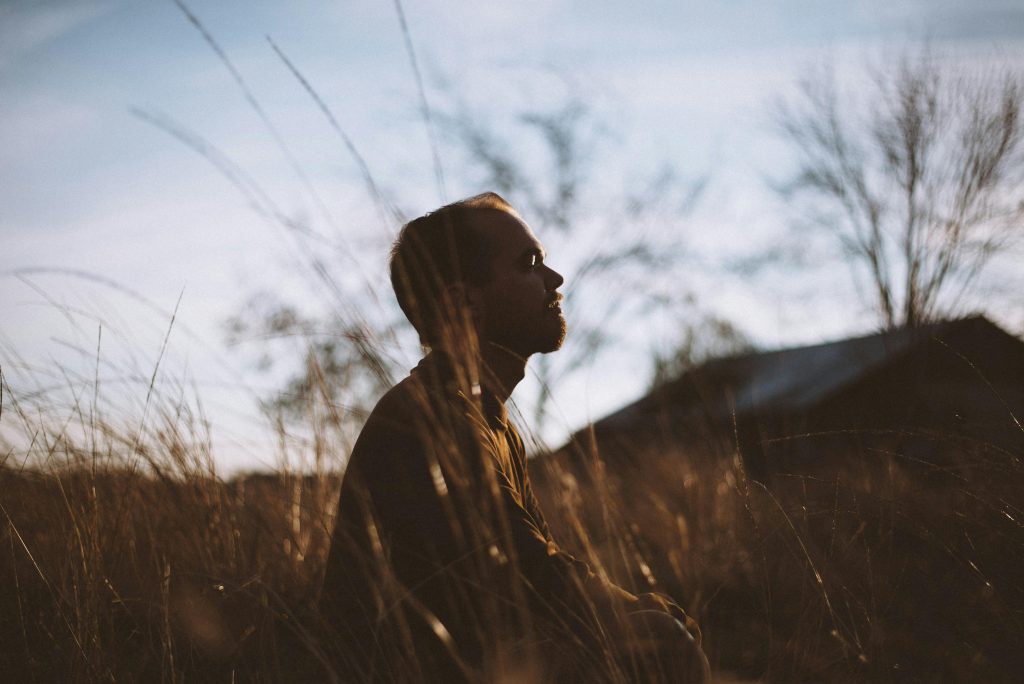 Photo by Spencer Selover: https://www.pexels.com/photo/silhouette-of-man-sitting-on-grass-field-at-daytime-775417/